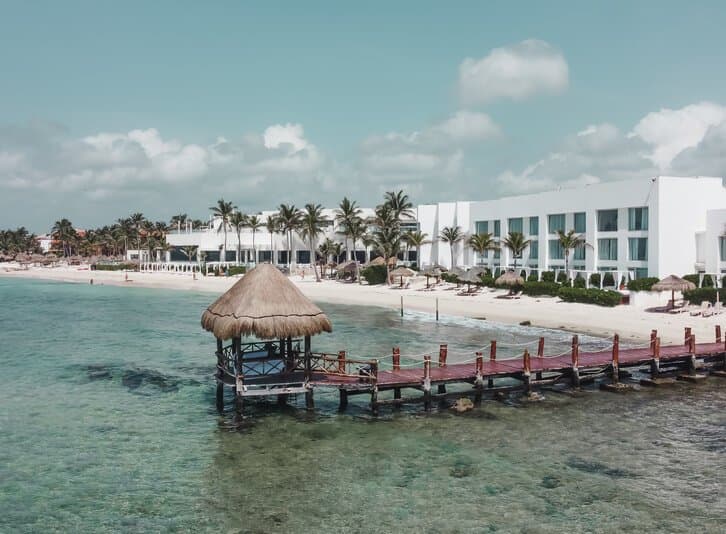 KiddoZone pool area with children's slides and a fungus-shaped fountain